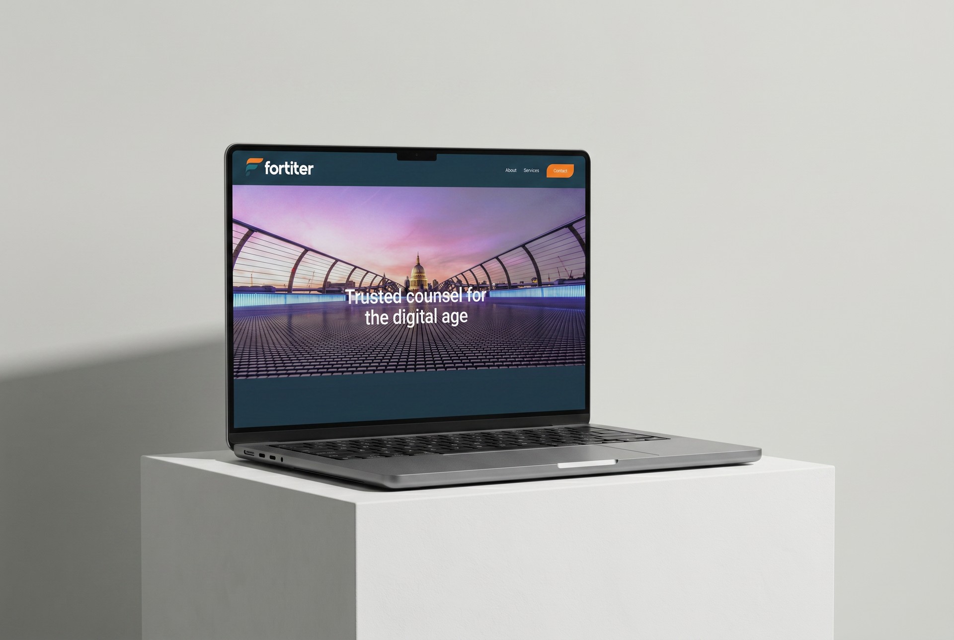 fortiter.co.uk homepage on a laptop, the Millennium Bridge hero on screen