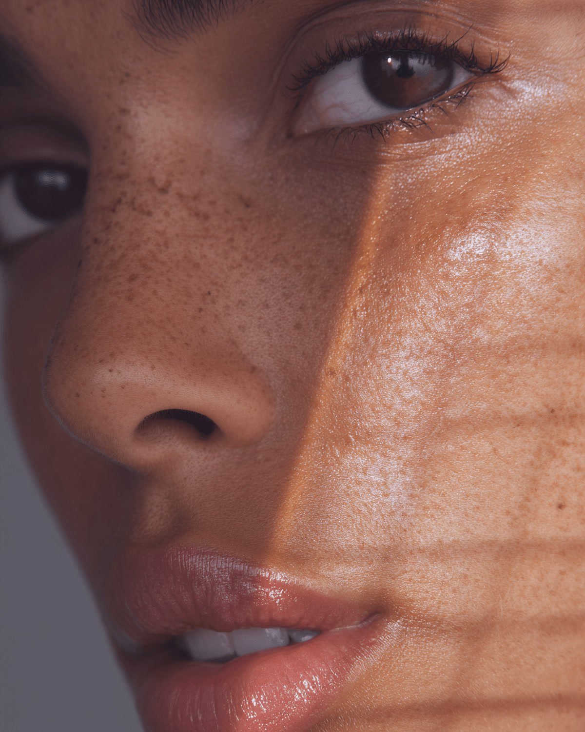 Brand library, window light falling across a freckled face