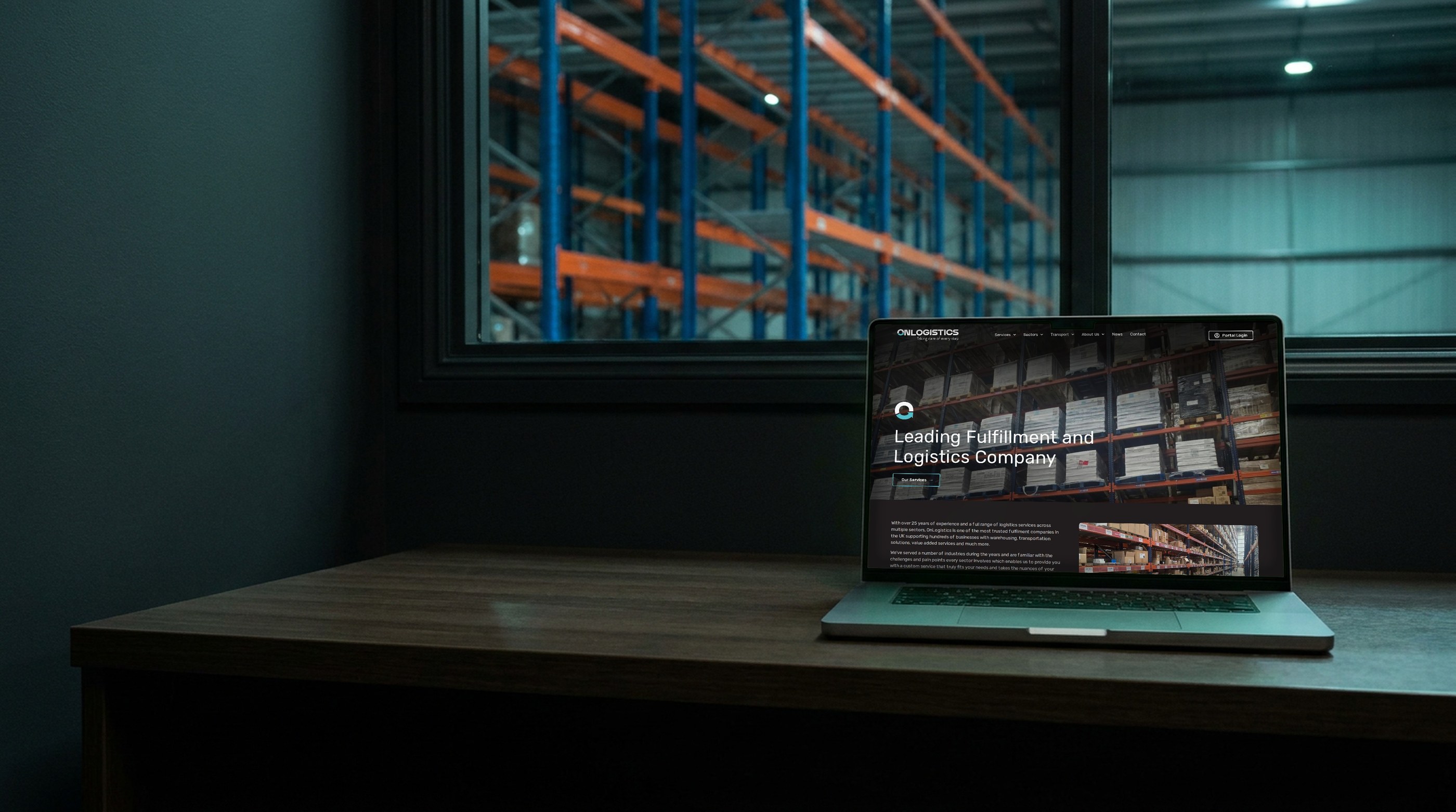 Logistics website design for OnLogistics: the live homepage on a laptop in a warehouse office overlooking pallet racking