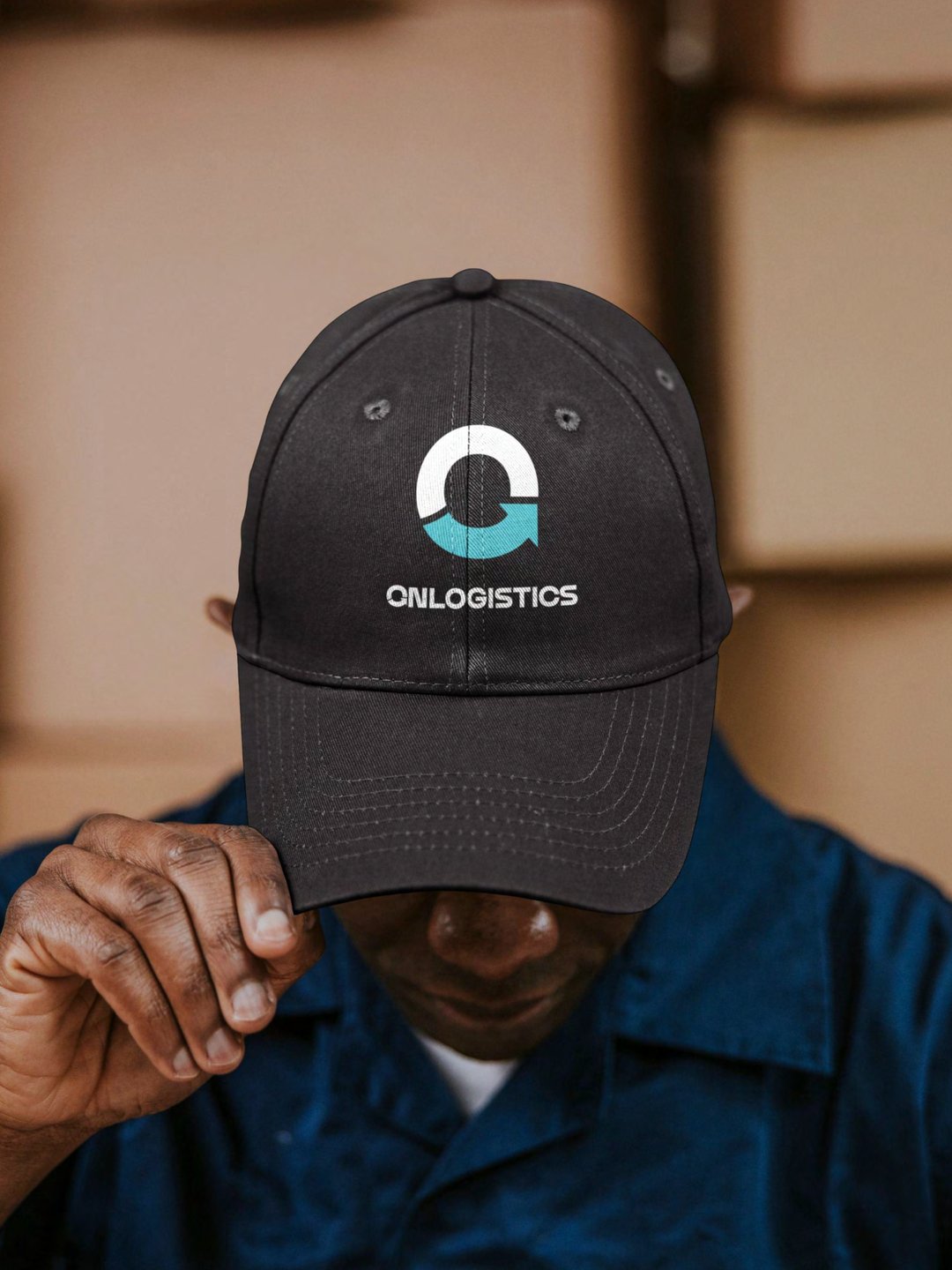 From the OnLogistics brand guidelines: the symbol and wordmark embroidered on a black cap