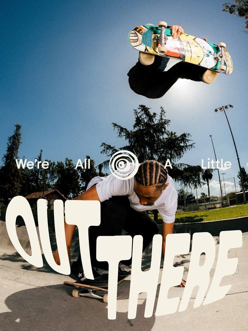 Out There, with Nyjah Huston by Combo: The OUT THERE wordmark swells and bends in perspective across a fisheye skate photo, as if it's being pulled into the lens