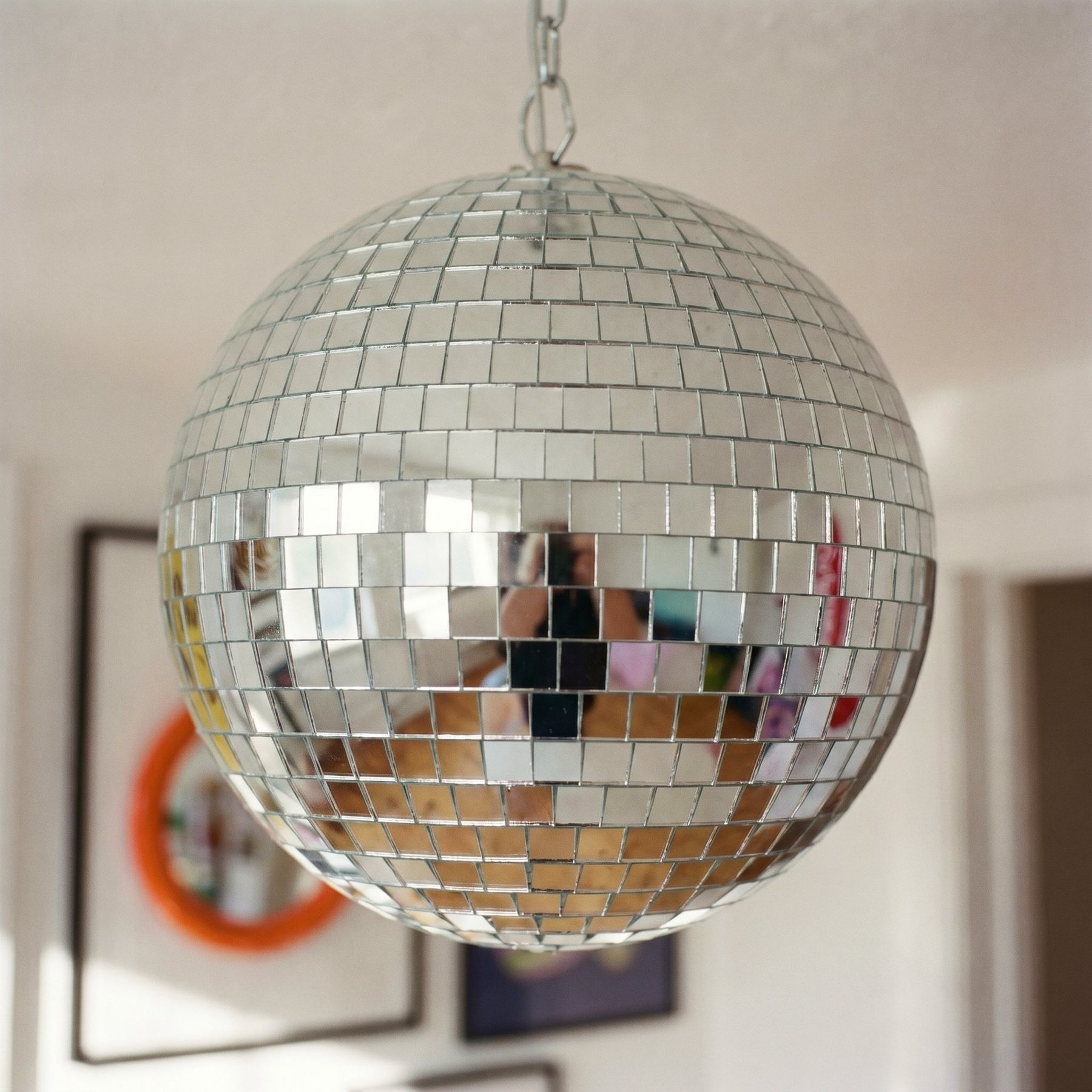 A disco ball hanging in the studio