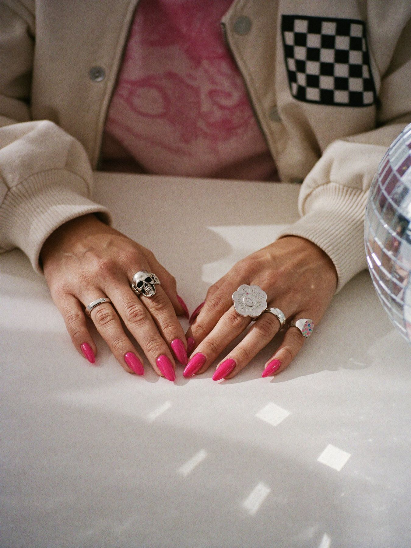 Hands making notes on a studio desk
